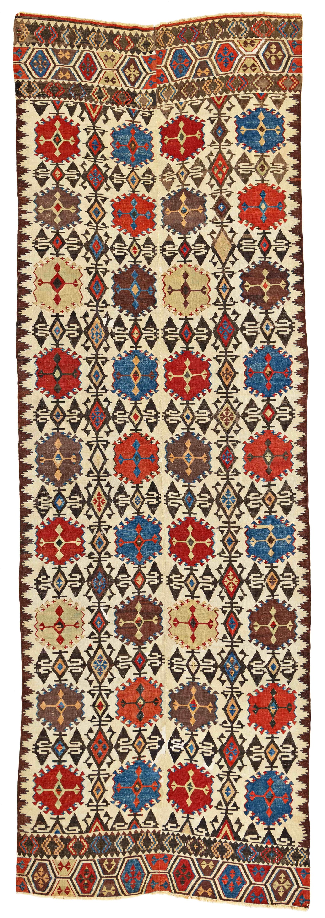 Konya Kilim: Konya Kilim 465 x 150 cm (15' 3" x 4' 11") Turkey, second half 19th century Condition: good, partially corroded dark brown, several small restorations Warp: wool, weft: wool