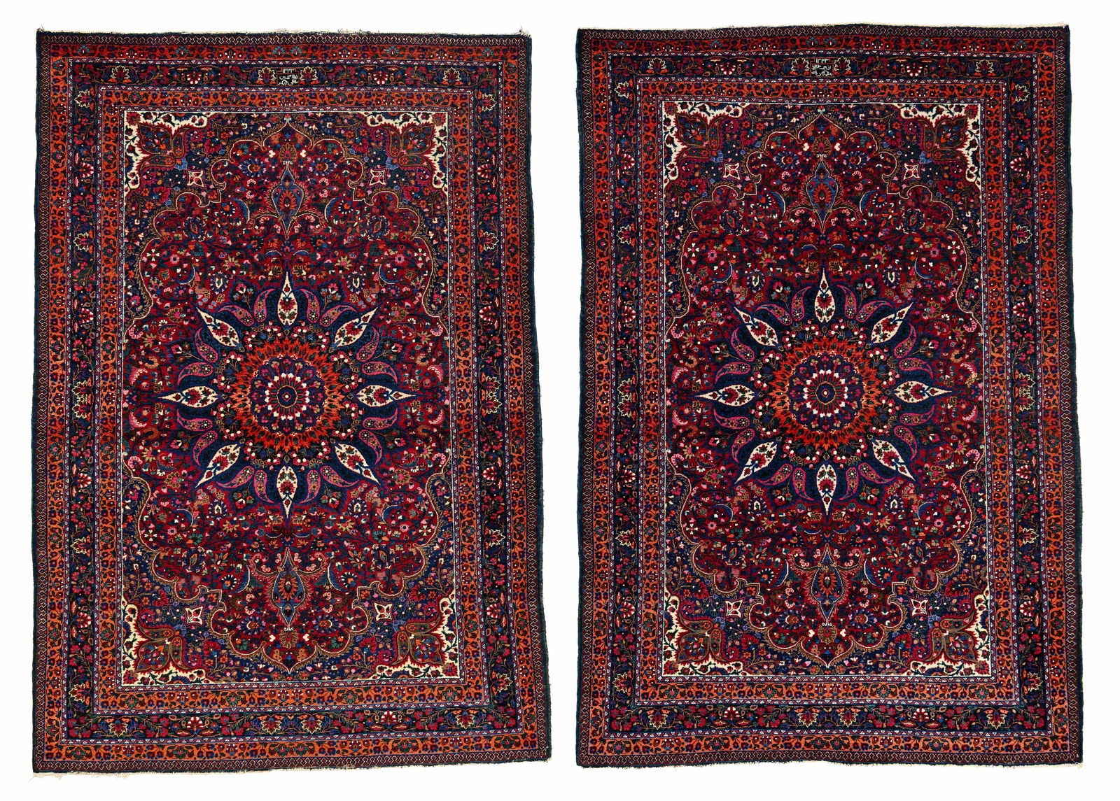A pair of signed Meshed Rugs: A pair of signed Meshed Rugs 208 x 142 cm and 209 x 141 cm (6' 10" x 4' 8" and 6' 10" x 4' 8") Persia, dated 1323 (1905) Condition: very good, mostly good pile, signs of use at sides and ends Signatur