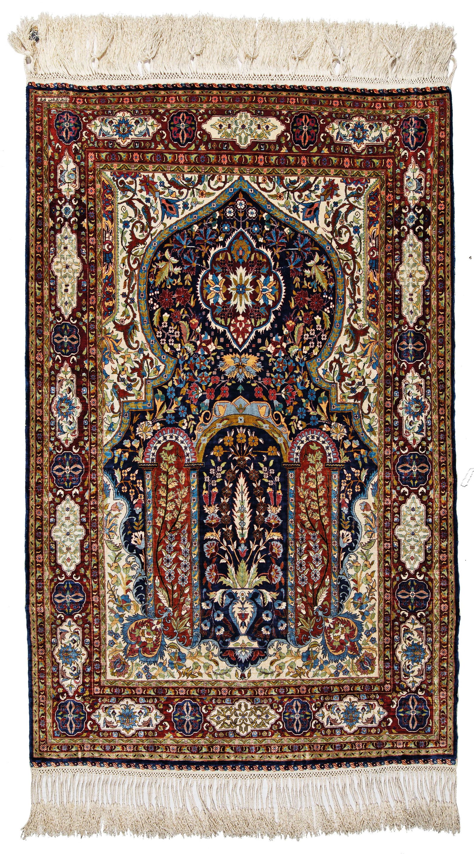 Signed silk Hereke Rug (24 x 24 knots per sqcm): Signed silk Hereke (24 x 24 knots per sqcm) 85 x 53,5 cm (2' 9" x 1' 9") Turkey, second half 20th century Condition: very good, full pile, three sewn tears (because of broken warp) Warp: silk, weft: s