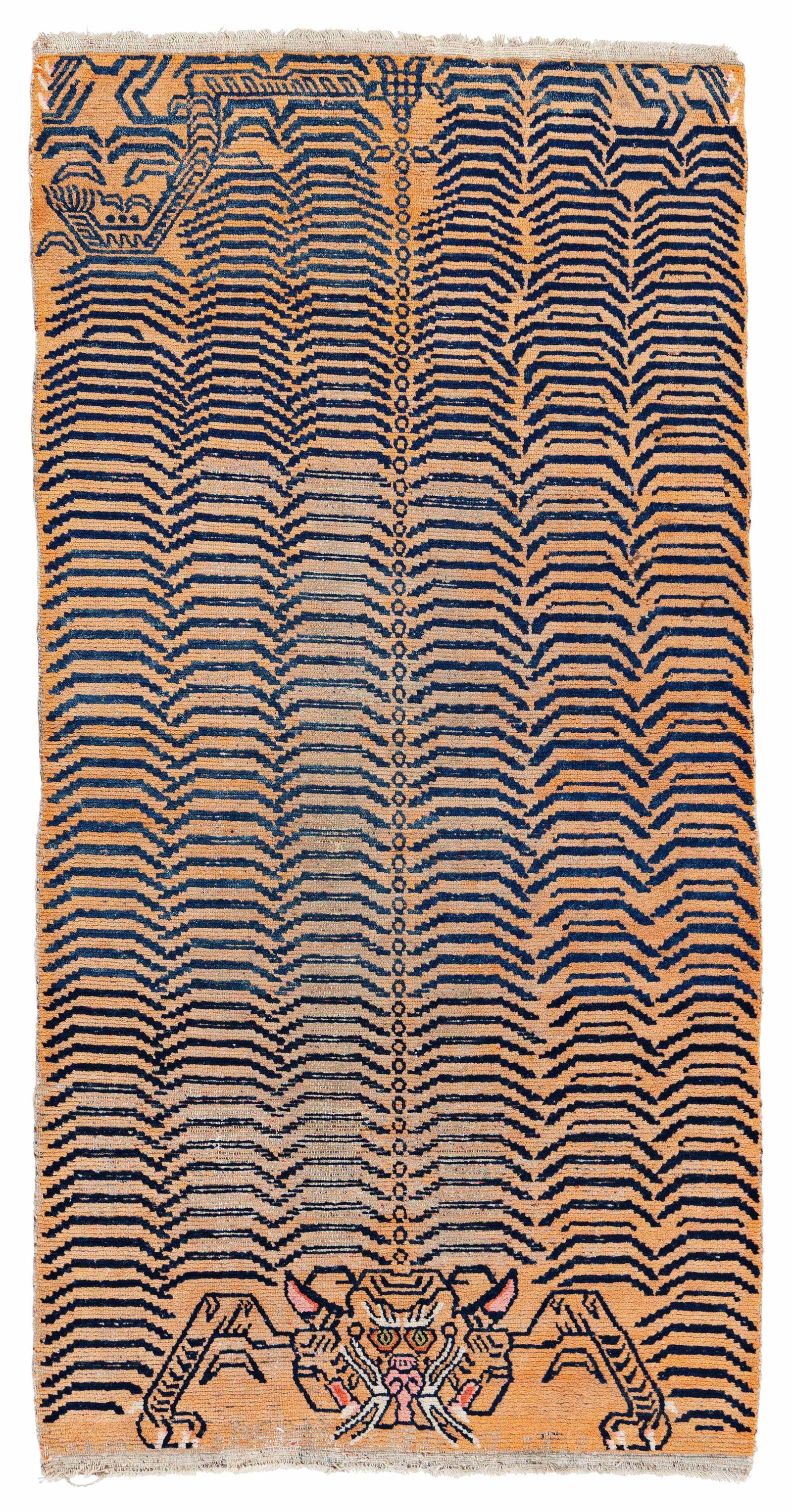 Tibet Tiger Rug: Tibet Tiger Rug 170 x 86 cm (5' 7" x 2' 10") Tibet, early 20th century Condition: used, low pile in places, scattered small moth damage, scattered small repairs, signs of use Warp: wool, weft: wool,