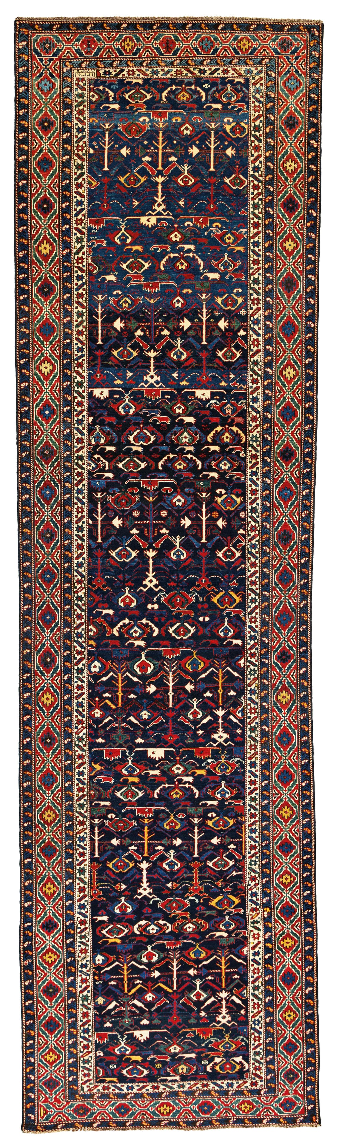 Early Kuba Rug: Early Kuba 443 x 117 cm (14' 6" x 3' 10") Caucasus, dated 1231 (1813) Condition: good, good pile, upper end restored, scattered small repairs, minor small moth damages Warp: wool, weft: cotton, pile: