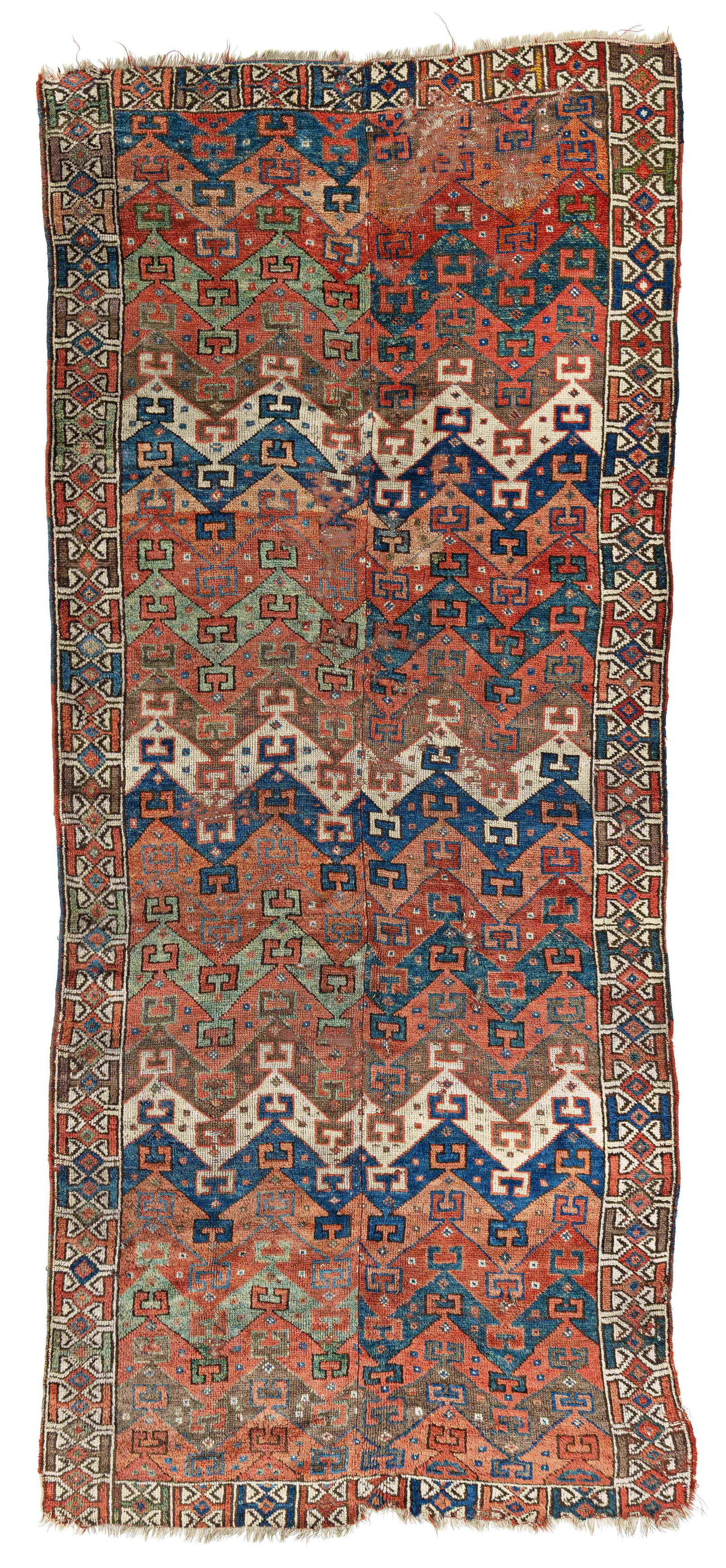 East Anatolian Kurdish Rug Fragment: East Anatolian Kurdish Rug Fragment 286 x 119 cm (9' 5" x 3' 11") Turkey, first half 19th century Condition: fragment, sewn together in the middle, several old repairs, missing parts and small holes