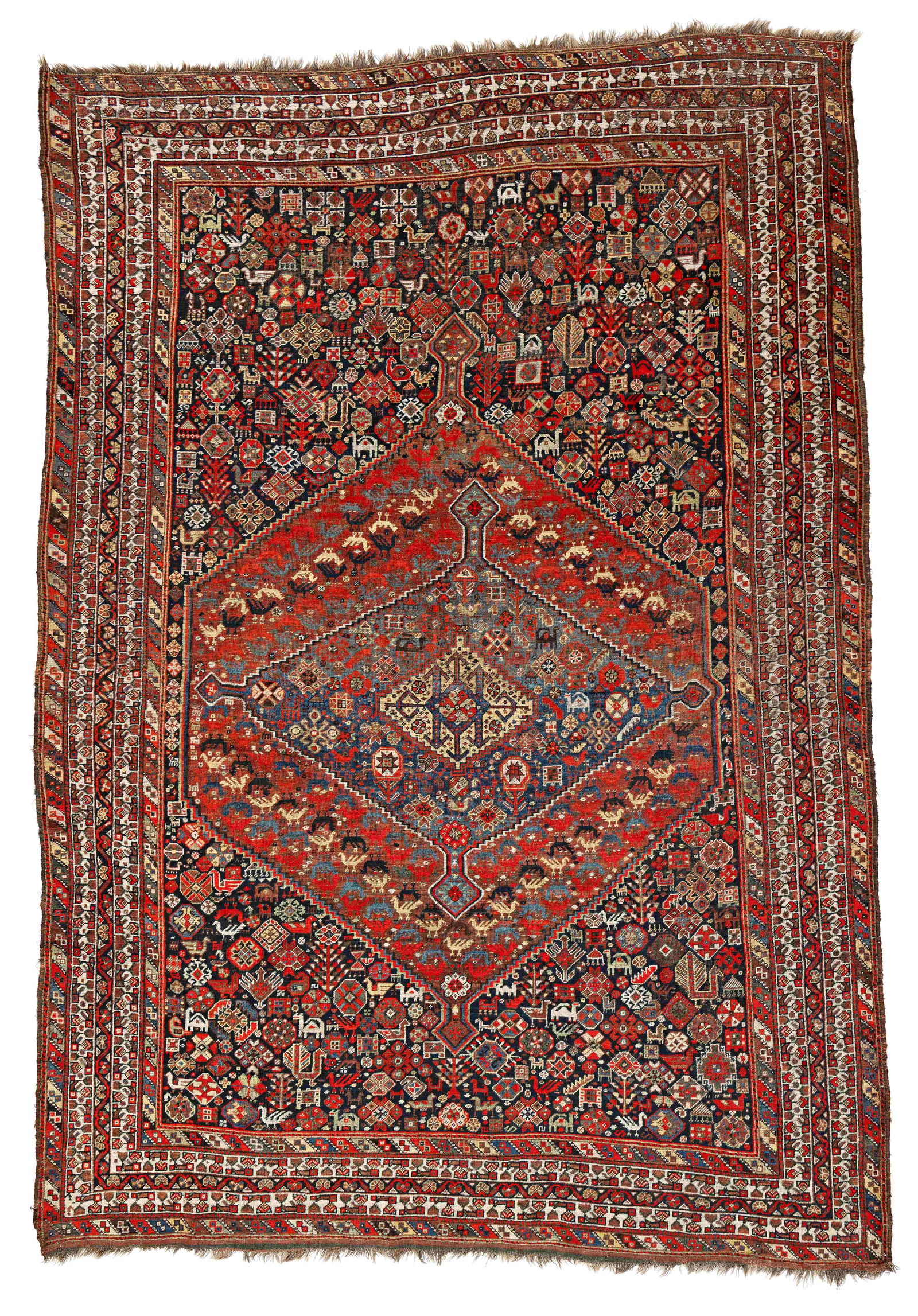Khamseh Rug: Khamseh 290 x 205 cm (9' 6" x 6' 9") Persia, ca. 1920 Condition: good, low pile in places, signs of use at sides and ends, scattered small repairs, small moth damage Warp: wool, weft: wool, pile: wool
