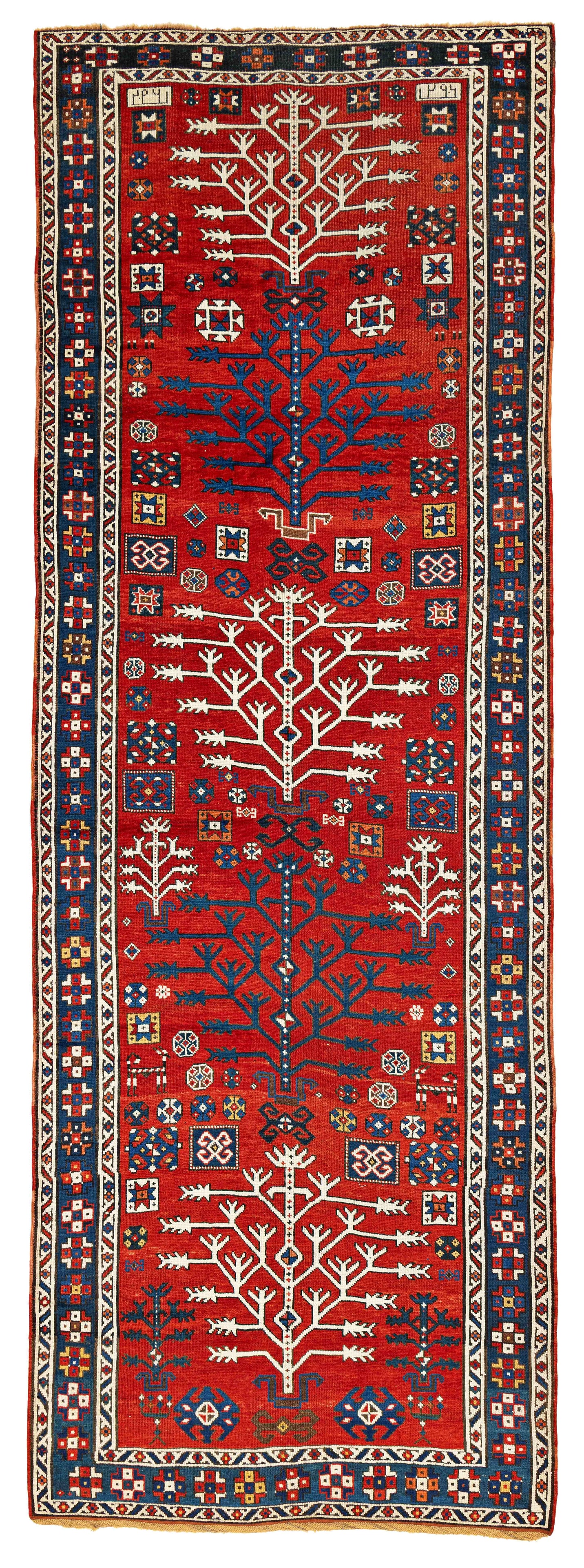 Tree Kazak Rug: Tree Kazak 374 x 130 cm (12' 3" x 4' 3") Caucasus, dated 1296 (1878) Condition: good, scattered low pile, scattered small repairs, slight signs of use Warp: wool, weft: wool, pile: wool