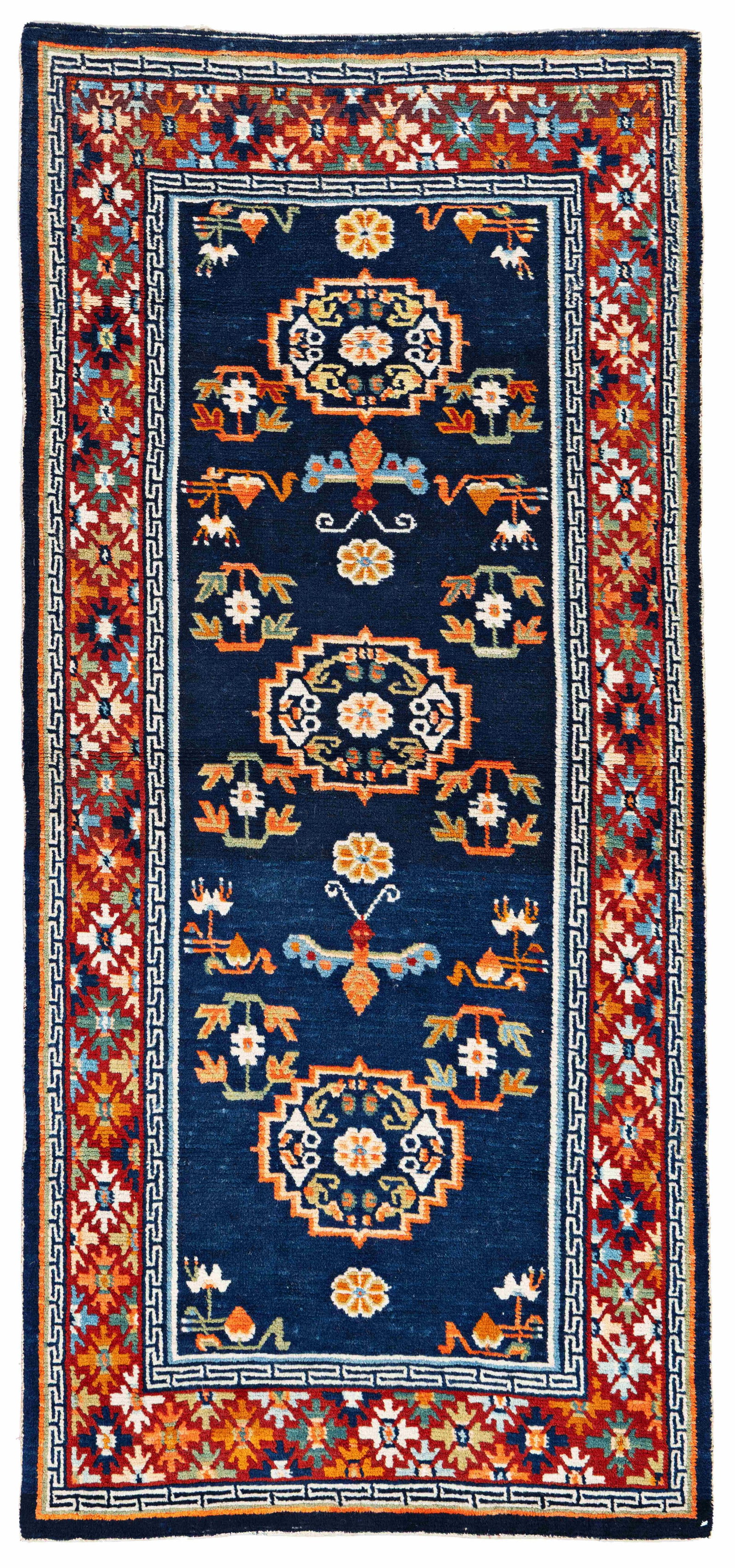 Tibet Khaden Rug: Tibet Khaden 171 x 78 cm (5' 7" x 2' 7") Tibet, early 20th century Condition: very good, good pile, minor small repairs, backed with fabric Warp: wool, weft: wool, pile: wool