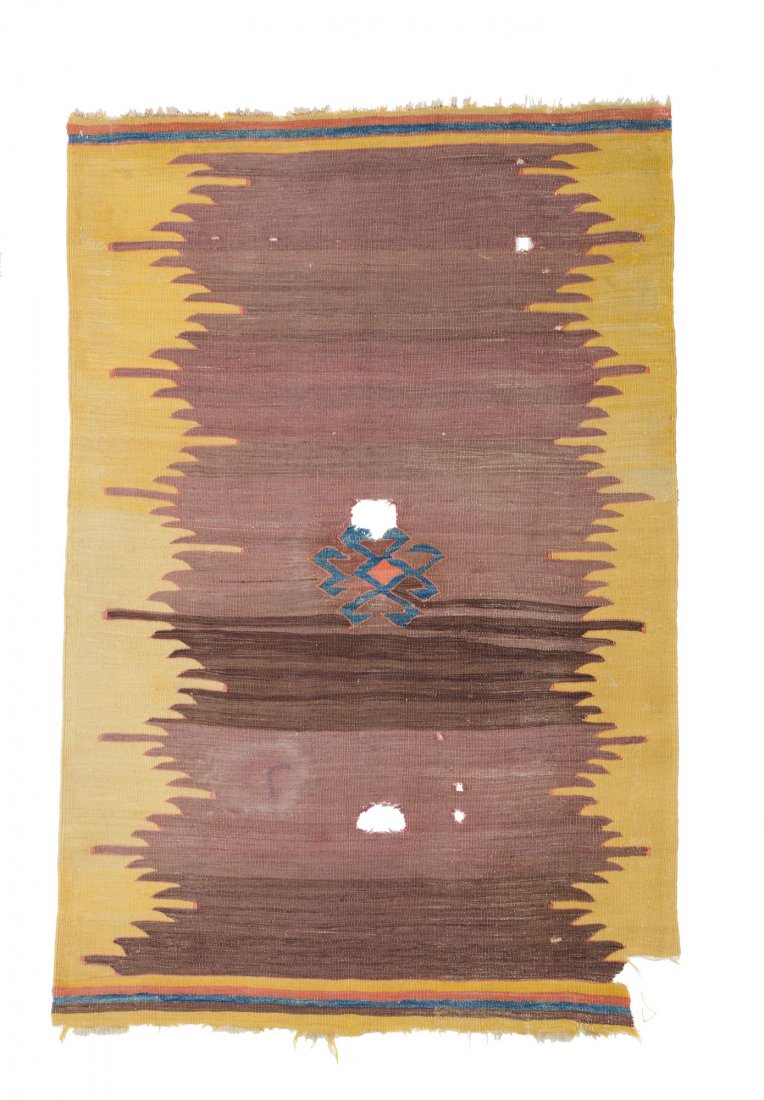 Cappadocia kelim: Cappadocia kelim 4ft. 9in. x 3ft. 2in. 145 x 97 cm Turkey second half 19th century Condition: several holes and large gouge at bottom right, one stain in the field Wool warp, wool weft