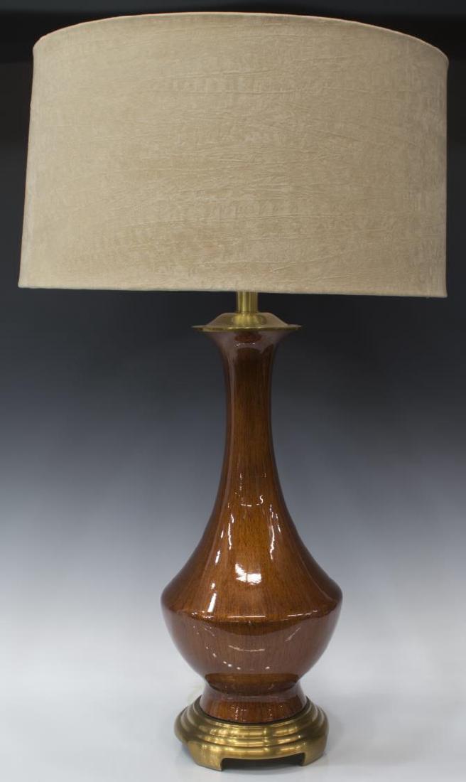 FREDRICK COOPER WOOD-LOOK CERAMIC TABLE LAMP: Frederick Cooper wood-look ceramic table lamp, a modern suede-like circular shade over vasiform body of a high gloss wood grain style finish, rising on gilt metal footed base, chip to one side, approx
