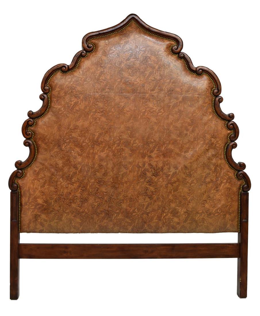 TOOLED LEATHER & SCROLLED WOOD HEADBOARD: Emerson Et Cie headboard having scrolled wood frame centering padded tooled leather backing, affixed with brass tacks, overall: 79.5"h, 69.25"w Start Price: $100.00