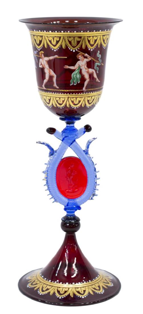 FINE VENETIAN PARCEL GILT RUBY ART GLASS GOBLET: Venetian parcel gilt ruby red art glass goblet, the large bowl having parcel gilt borders and decorated with a surround of classical nude figures, central figural medallion enclosed by blue border and