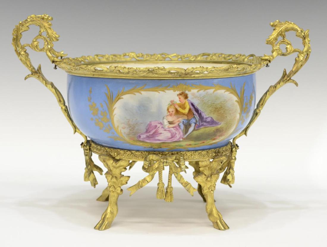 SEVRES STYLE PORCELAIN & GILT METAL CENTER BOWL: Sevres style porcelain and gilt metal center bowl, with polychrome scene lovers scene, decorated verso with a large floral spray, painted ivy band and spray to interior, floral and acanthus scroll han