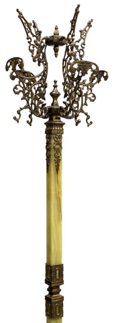 CONTINENTAL ONYX & BRASS FIGURAL COAT / HAT RACK: Continental onyx and brass coat stand, shaped and pierced hooks, surmounting the onyx standard, rising on figural legs, ending in paw feet Start Price: $150.00