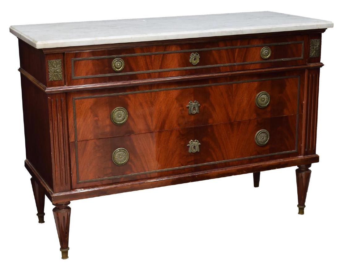 FRENCH LOUIS XVI STYLE MARBLE TOP COMMODE 20TH C: French Louis XVI style marble top commode, early 20th c., having a white variegated top over the case fitted with three drawers, each with brass ring pulls, rising on grooved tapered feet, 33.5"h, 47.