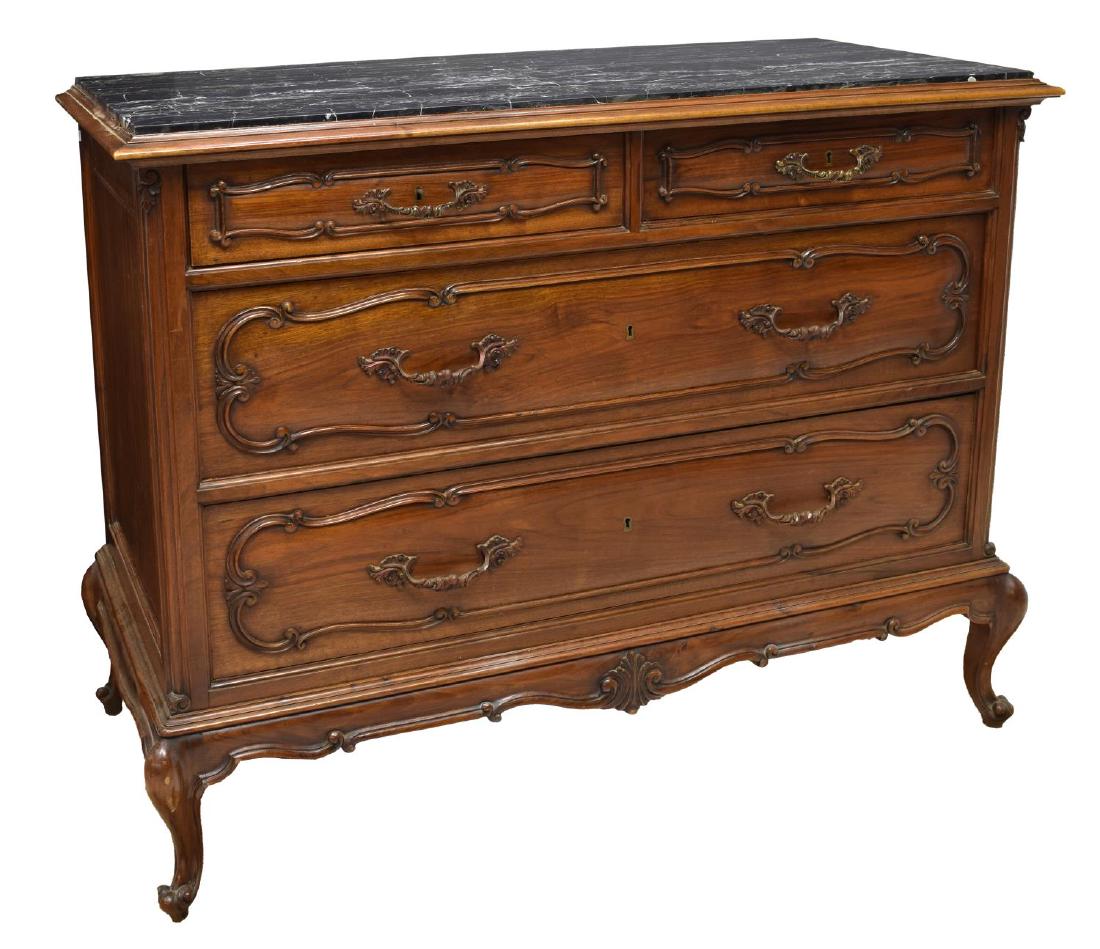 ITALIAN CARVED WALNUT MARBLE TOP COMMODE: Italian Louis XV style walnut commode, 20th c., having a veined black inset marble top, over the case fitted with two small aligned drawers, over two larger drawers, all on short cabriole legs, ending