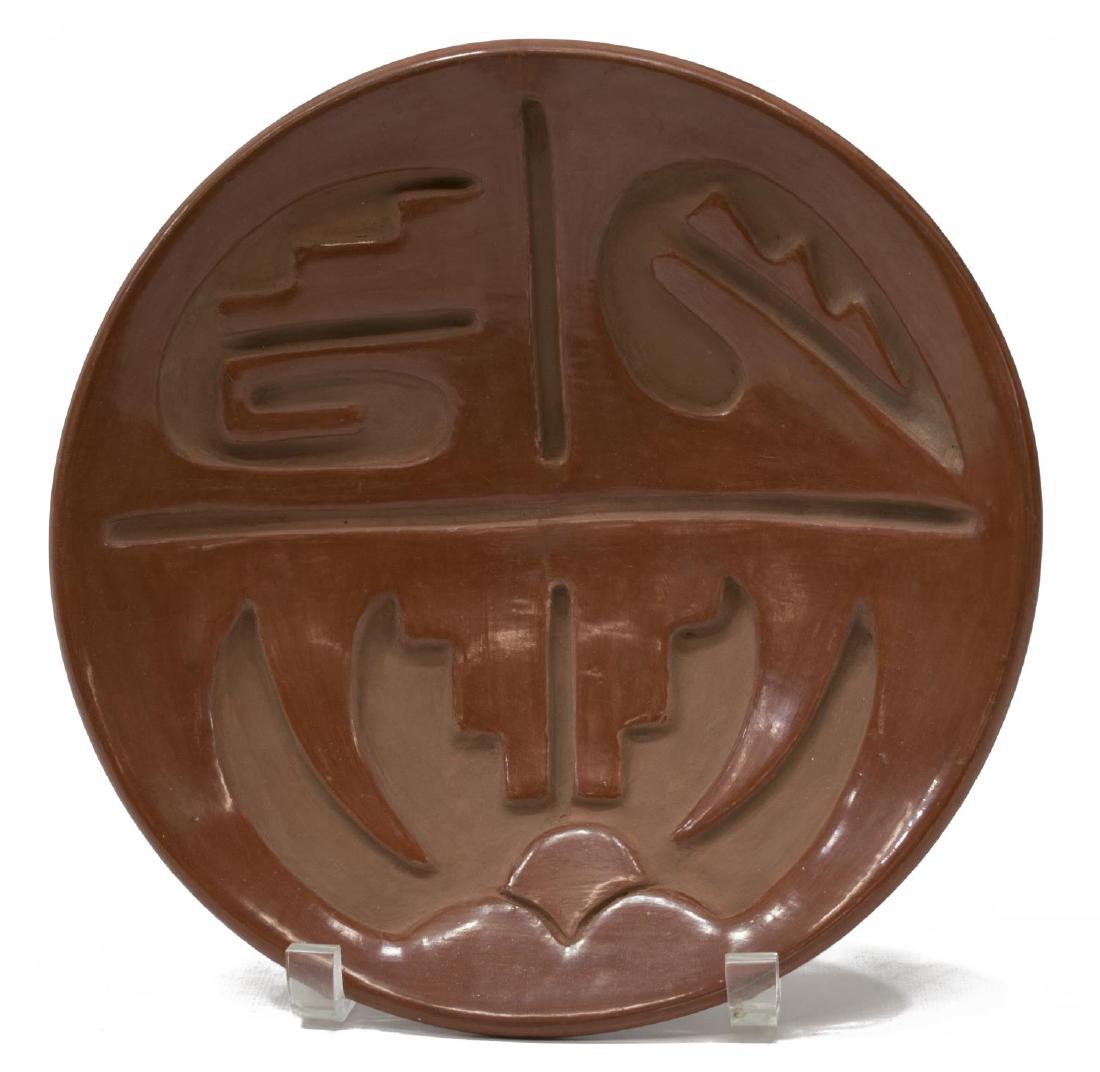 SANTA CLARA REDWARE PLATE: Santa Clara Pueblo, New Mexico, redware plate, deep cut design, 2"h, 9.7/8" diameter, 2lbs Start Price: $80.00