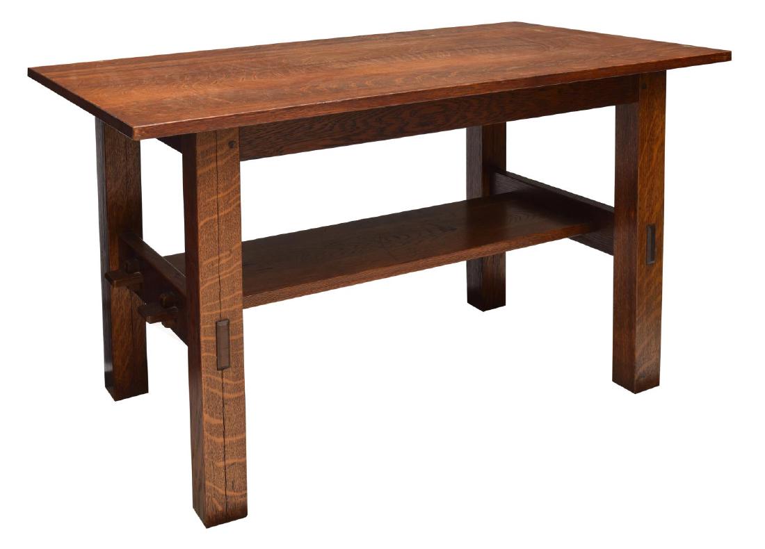 GUSTAV STICKLEY CRAFTSMAN WORKSHOP LIBRARY TABLE: Gustav Stickley library table, rectangular on squared supports joined by a lower shelf, remnants of 1907-1912 Craftsman Workshop, New York label at underside, open seam at one leg, 30"h, 48.25"w, 29.5