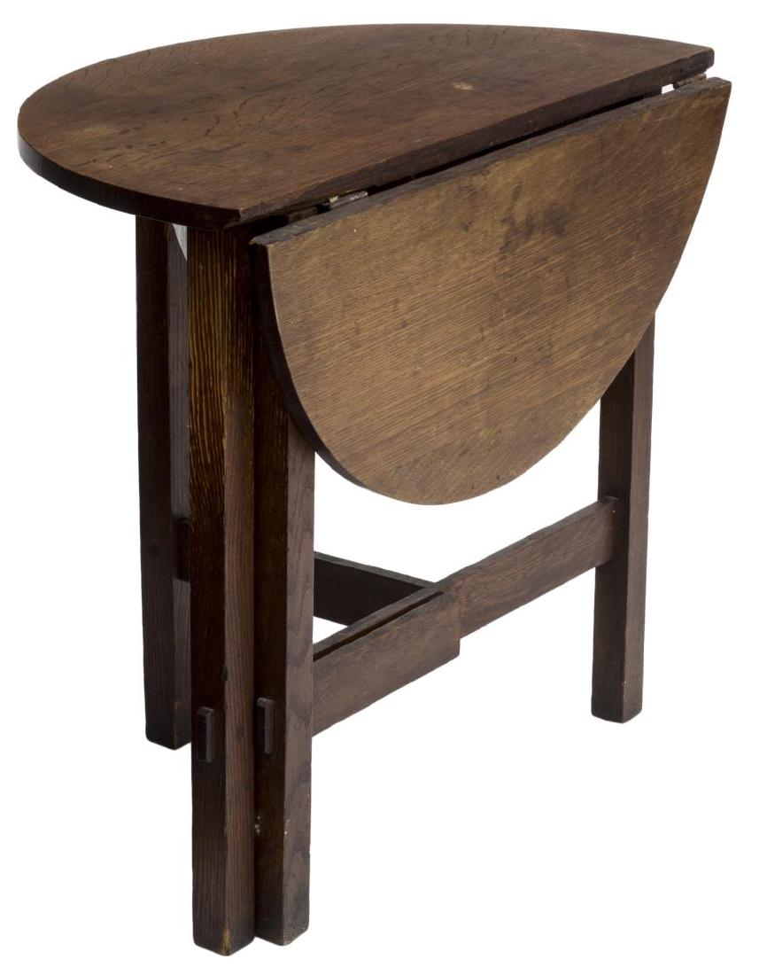 ARTS & CRAFTS OAK GATE LEG DROP LEAF SIDE TABLE: Arts and Crafts oak demi-lune table, having a drop leaf, creating a circular top, rising on square legs with hinged gate legs, joined support, 26"h, 28.5" diam. Start Price: $60.00