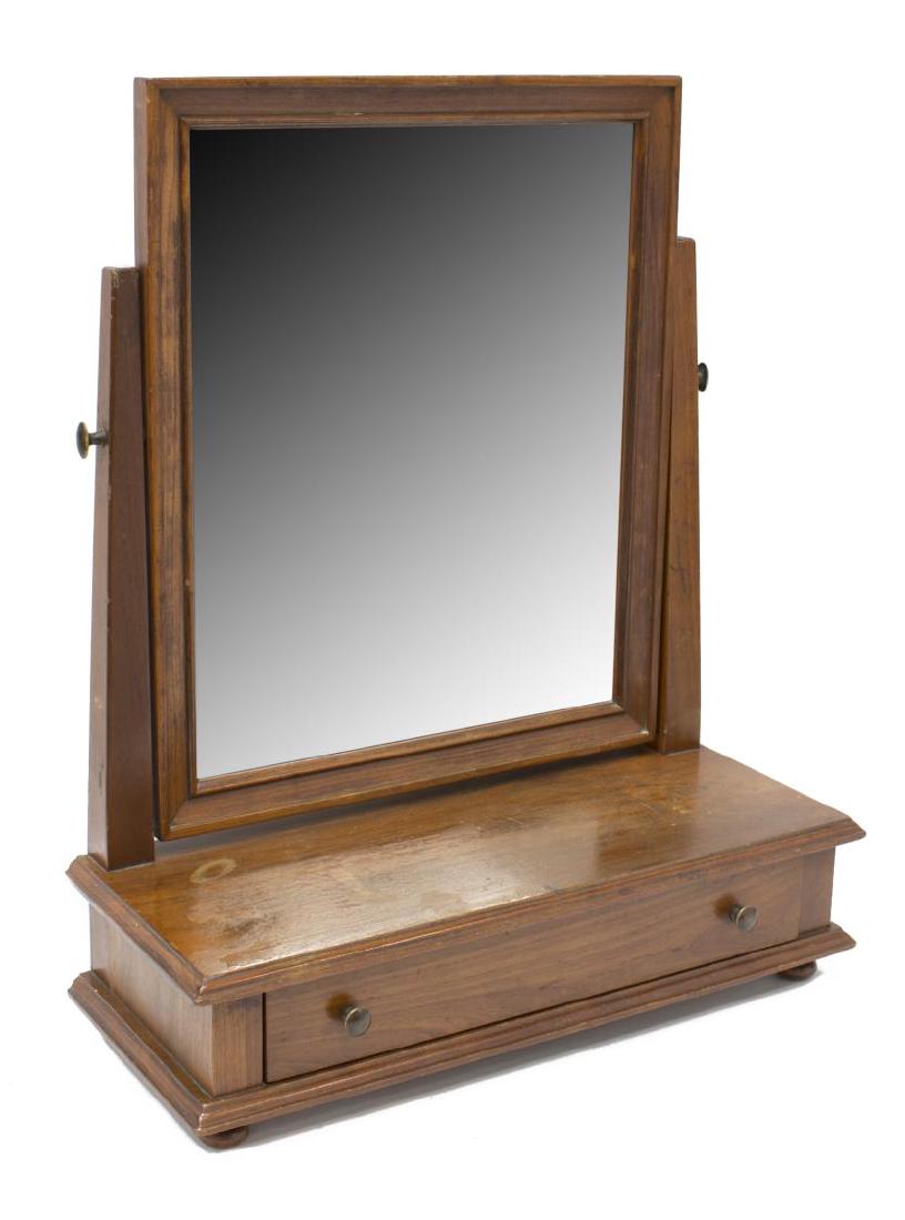 L & JG STICKLEY SHAVING OR DRESSER TOP MIRROR: L.& J. G. Stickley shaving mirror, tilting beveled glass over a single drawer, the J & LG Stickley incised mark "Stickley, Fayetteville, Syracuse" at back, 22.75"h, 18.75"w, 7.5"d Start Price: $80.00