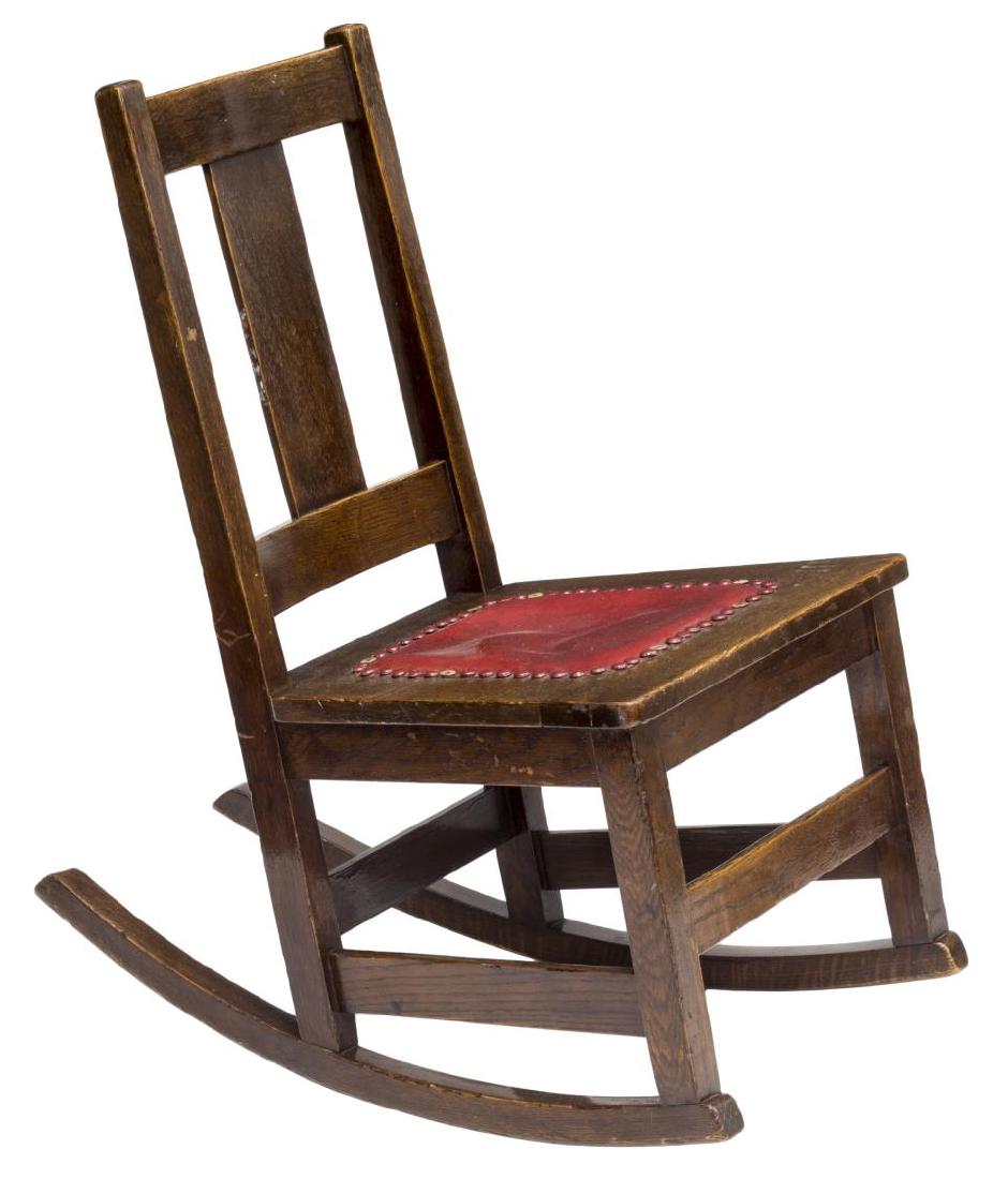 LIMBERT ARTS & CRAFTS OAK SEWING ROCKER: Limbert Arts & Crafts oak sewing rocking chair, red leather seat, makers stamp at underside, 32"h, 17.25"w, 28.5"d Start Price: $80.00