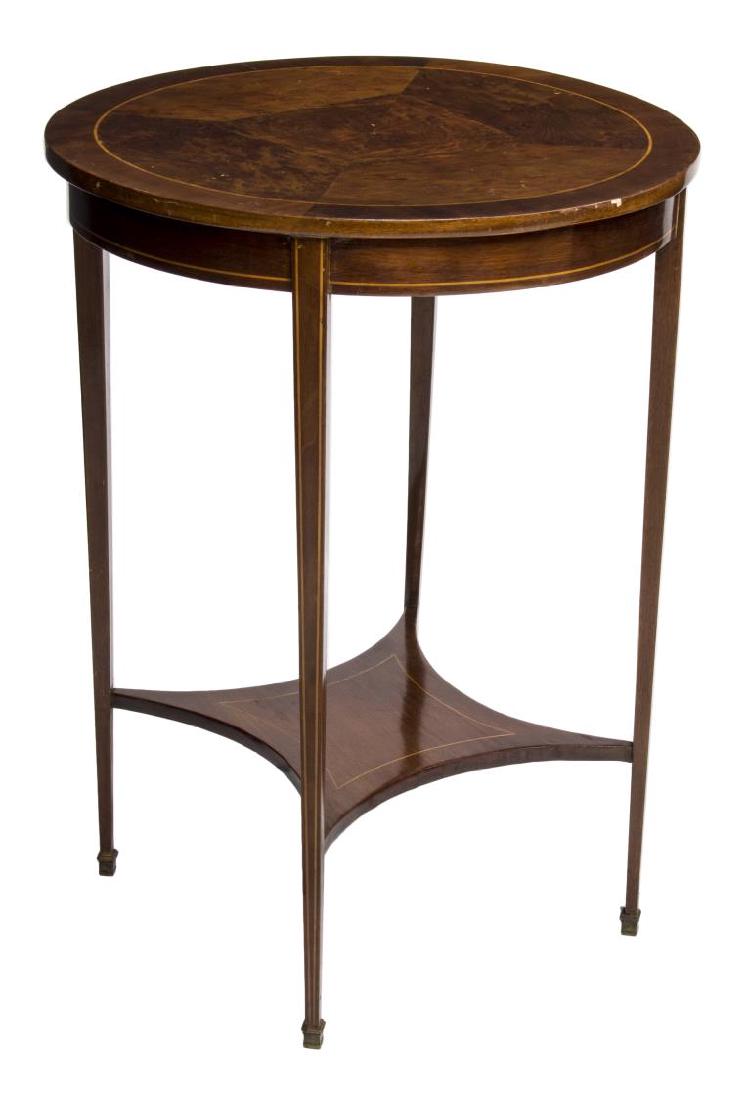 EDWARDIAN INLAID CIRCULAR OCCASIONAL TABLE, 20TH C: Edwardian inlaid circular occasional table, early 20th c., having a round top rising on tapered legs joined by a lower shelf stretcher, 29"h, 21.5" diam. Start Price: $80.00