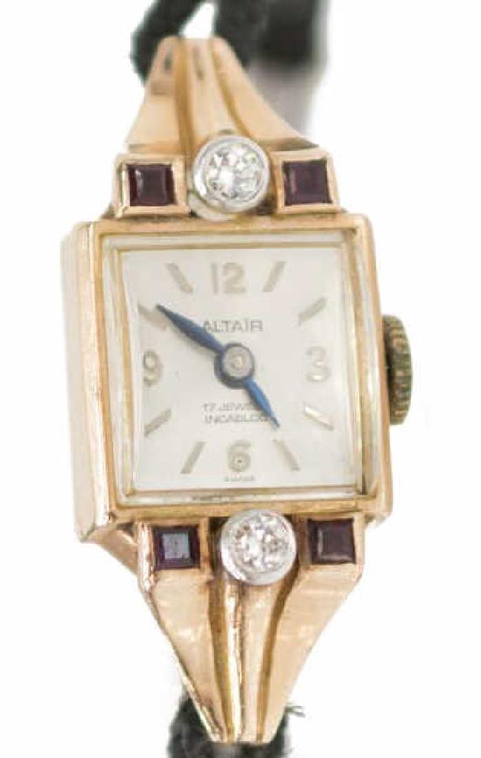 LADIES ESTATE 14K ROSE GOLD DIAMOND WRIST WATCH: Ladies estate 14kt rose gold Altar dress watch, 17j manual movement, the square face with baton hour markers, flanked by (2) round cut diamonds, 0.035ct each, and (4) square cut red stones, presented 