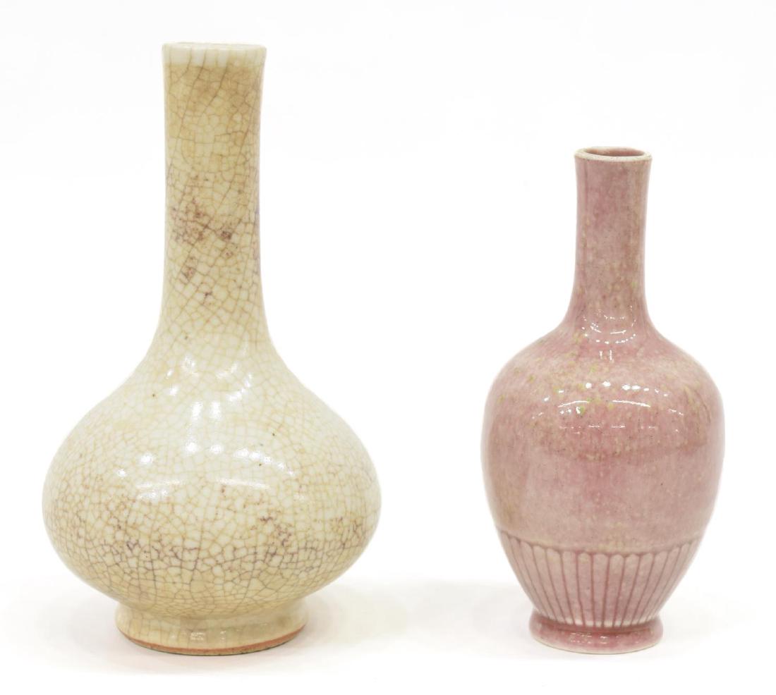 (2) CHINESE STICK NECK GLAZED PORCELAIN BOTTLES: (lot of 2) Chinese stick neck glazed porcelain bottles, comprising: (1) "peach bloom" glazed bottle, having a long neck over ovoid body, incised pattern around base, signed underfoot, flaws to glaze,