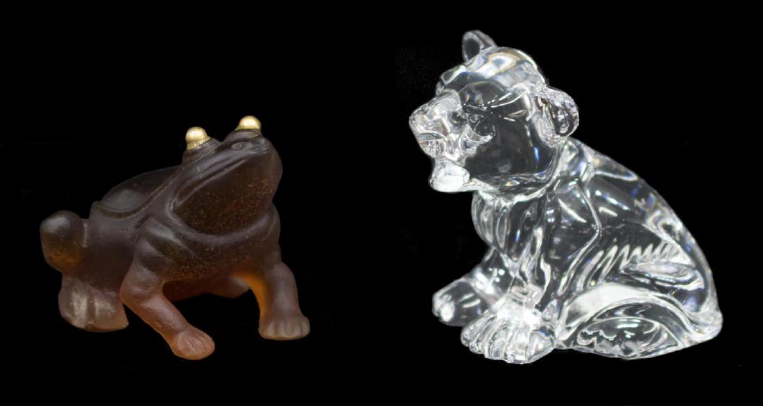 (2) DAUM FROG & WATERFORD LION CUB FIGURES: (lot of 2) Continental art glass and crystal animal figures, including: (1) Daum France art glass frog, gilt eyes, etched maker's mark underfoot, 2.25"h; (1) Waterford crystal lion cub, signed and dat