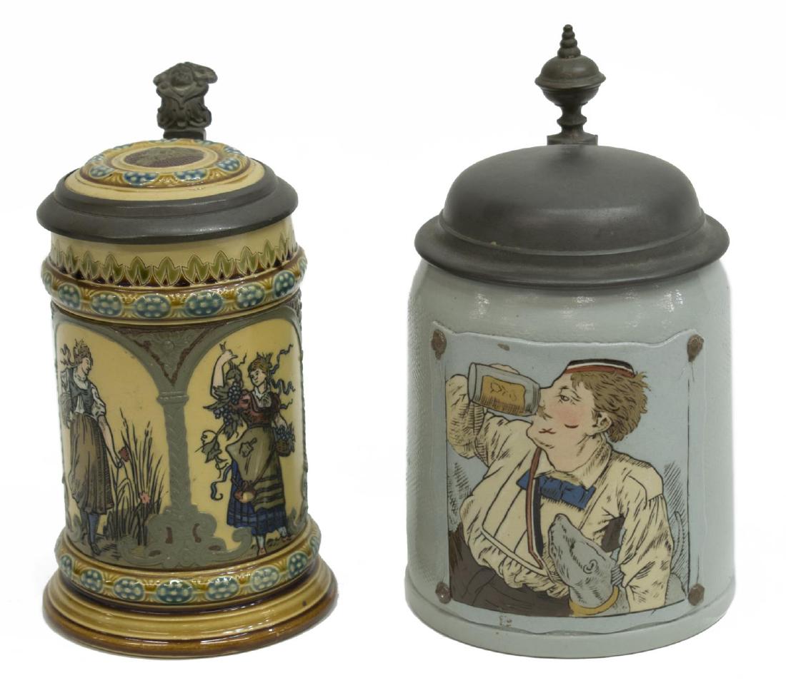 (2)METTLACH TAPESTRY & ETCHED STEINS, #1643, #1972: (lot of 2) Mettlach beer steins: (1) #1643, c. 1902, tapestry stein having a blue ground, front scene of student drinking, engraved banner beneath handle, pewter lid and thumb rest, engraved factory m