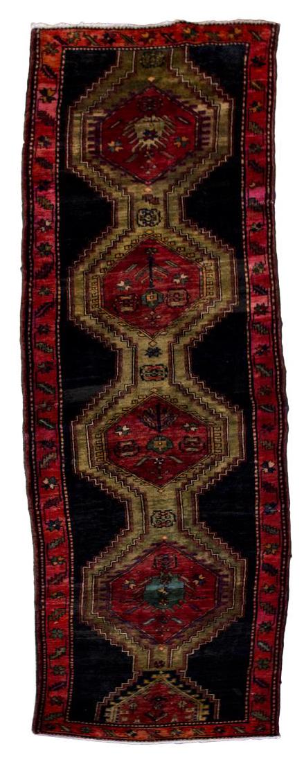 SERAPI HAND TIED WOOL RUNNER, APPROX 13'8" X 3'7": Persian Serapi hand tied wool runner rug, red, green and blue on black, some surface dirt, stains and fading, repair approximately 1" x 2", approx 13'8" x 3'7" Start Price: $200.00