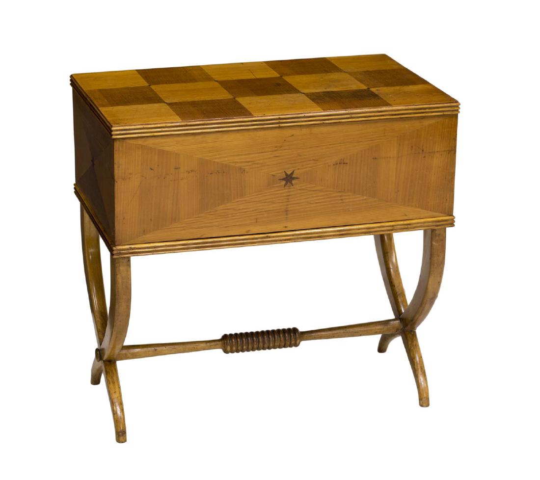 ITALIAN MID-CENTURY PARQUETRY SEWING BOX, C. 1950: Italian Mid-Century Modern sewing box on stand, c. 1950, the rectangular case with parquetry inlaid design to lid and sides, opening to blue satin lined interior, rising on curved legs with joined sup