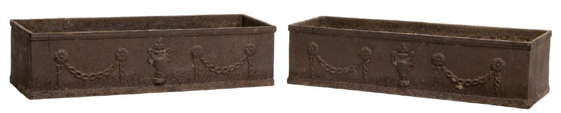 (2) FRENCH CAST IRON LOW RELIEF GARDEN URNS: (lot of 2) French cast iron garden planters of rectangular form, decorated in low relief with urn and floral swag, complete oxidation, 6'h, 23.75"l, 8.25"w Start Price: $80.00