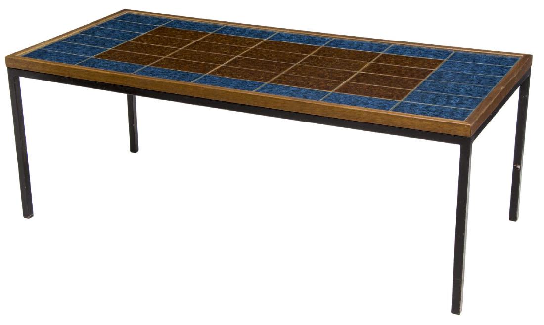 DANISH MID-CENTURY MODERN TILE TOP COFFEE TABLE: Danish mid-century modern coffee table, 1960's, the tile top framed with teakwood rising on squared black steel supports, 22"h, 58"w, 26"d Start Price: $100.00