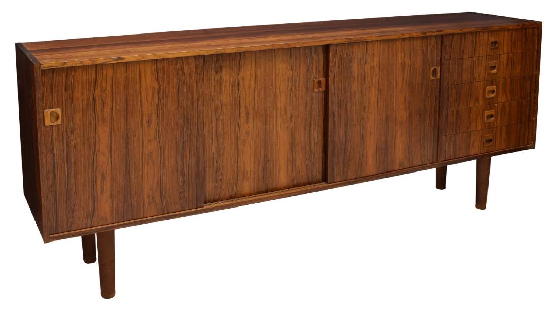 DANISH MID-CENTURY MODERN ROSEWOOD SIDEBOARD: Danish mid-century modern rosewood finish sideboard, 1960's, rectangular with three sliding doors and, at one end, five drawers, rising on turned supports, 32.5"h, 78.5"w, 16.25"d Start Price: $300.00