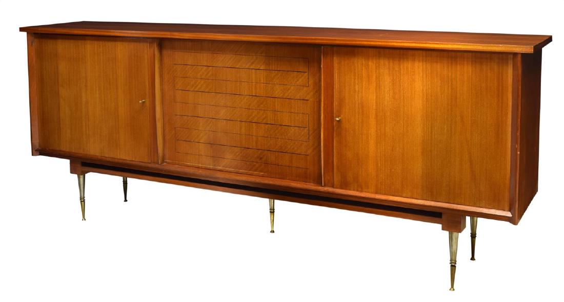 FRENCH MID CENTURY MODERN SIDEBOARD: French mid century modern sideboard, mid 20th c., in the manner of Chaleyssin, having two hinged cabinets and four drawers behind sliding door, rising on tapered legs, brass hardware and legs, approx.