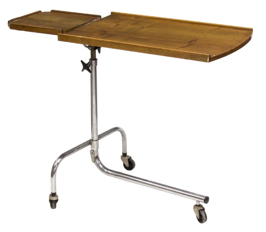 DANISH MID-CENTURY MODERN READING TABLE: Danish mid-century modern adjustable height tray table-reading table with two platforms by HMN rising from 25" to 36", the chrome steel frame on castors, 35"w, 20"d Start Price: $80.00