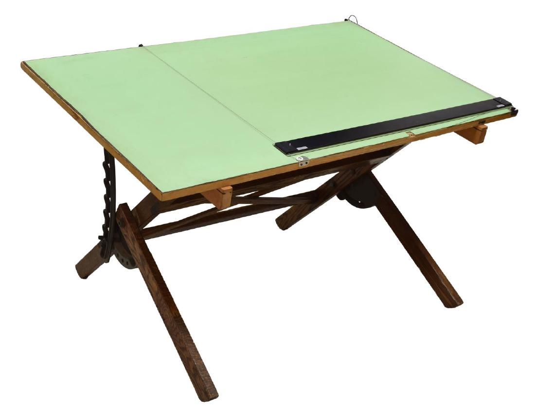 DIETZGEN OAK & IRON DRAFTING TABLE, 37.75" x 60": Dietzgen oak and iron framed drafting table, the top adjusts to desired angle, top only: 37.75"h, 60"w Start Price: $100.00