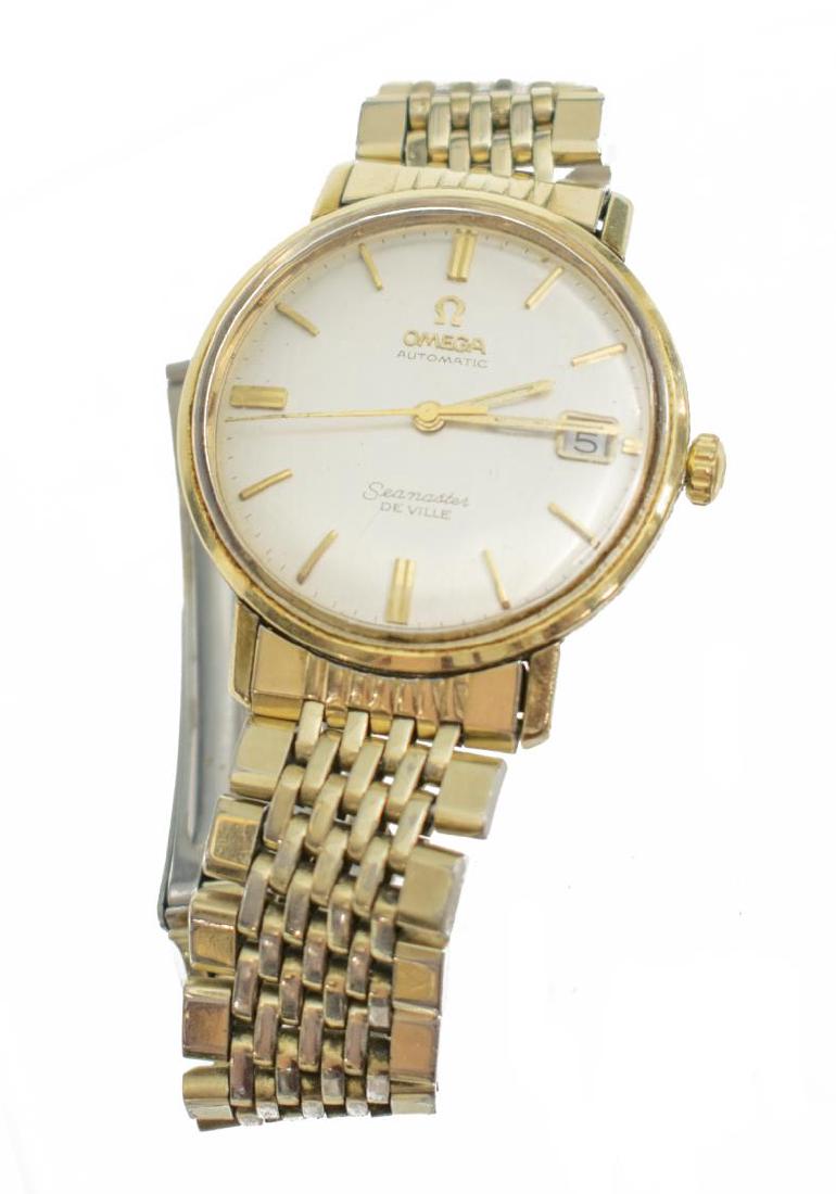 GENTS OMEGA SEAMASTER DE VILLE AUTOMATIC WATCH: Omega Seamaster De Ville automatic wind wrist watch, date subdial, gold filled, bracelet band marked Omega 1503 and Seiko at clasp, observed operating for 20 minutes Start Price: $100.00