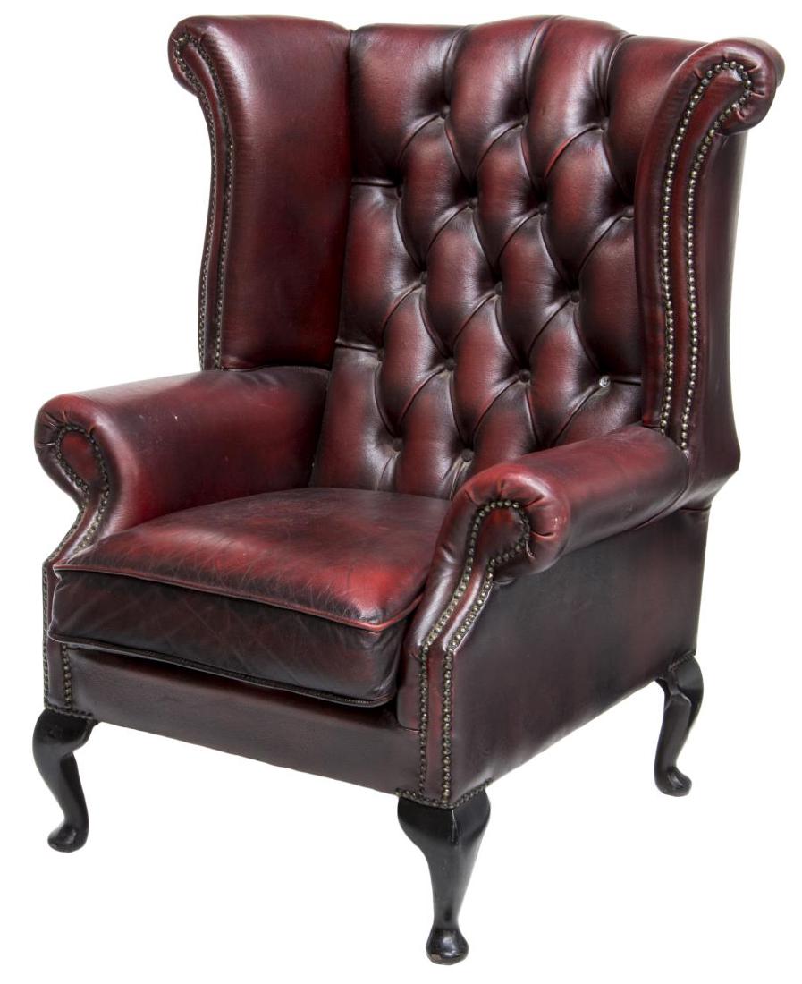 QUEEN ANNE STYLE BUTTONED LEATHER CLUB CHAIR: Queen Anne style maroon leather buttoned wingback club chair, a removable cushion, rising on pad foot cabriole legs, 40"h, 30"w, 26"d Start Price: $200.00