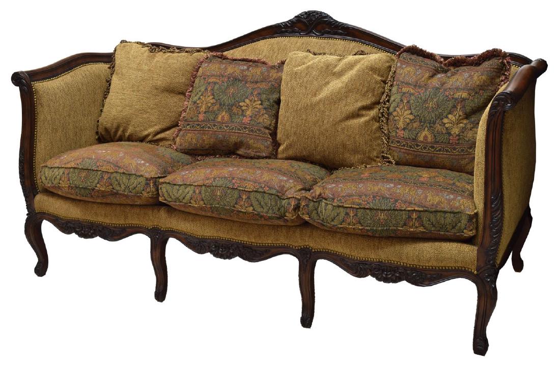 LOUIS XV STYLE THREE-SEAT UPHOLSTERED SETTEE: Louis XV style three-seat settee, having arched back, foliate scroll arms, with carved rail, chenille upholstery, held with brass tacks, carved apron, rising on cabriole legs, some loss to finish, spl