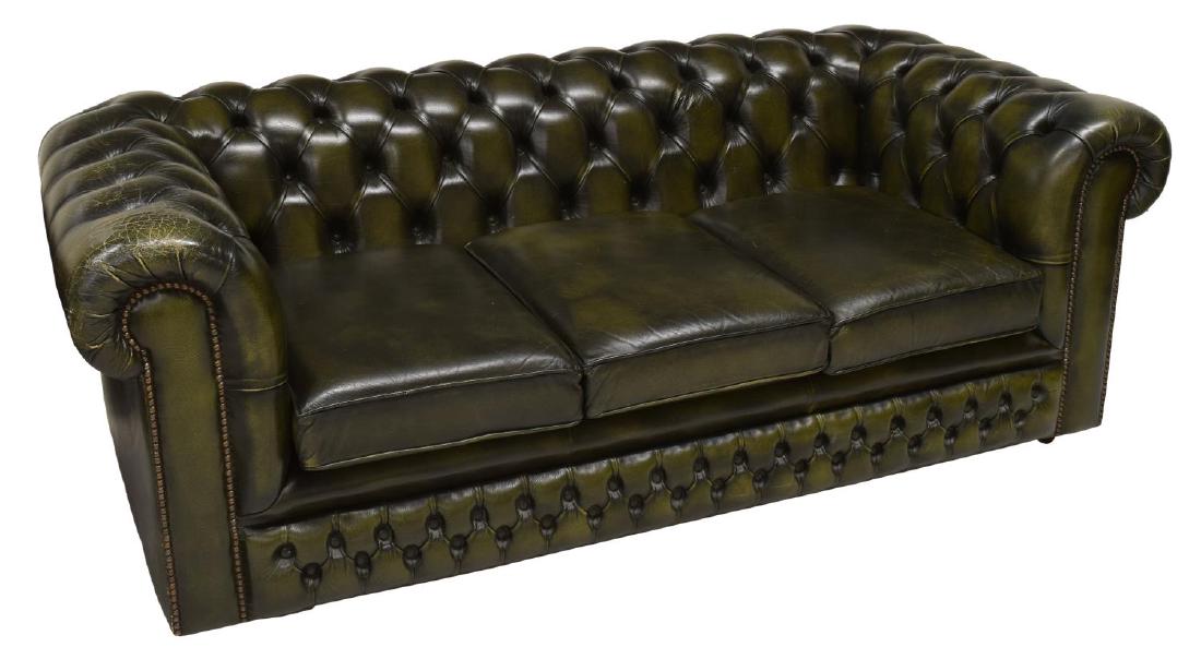 CHESTERFIELD GREEN BUTTONED LEATHER SOFA: Chesterfield sofa in buttoned green leather, having three removable seat cushions, rising on castors, 27"h, 74"w, 36"d Start Price: $300.00
