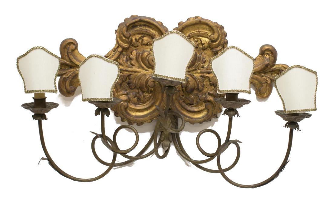 LOUIS XV STYLE PARCEL GILT 5-LIGHT WALL SCONCE: Louis XV style wall sconce, parcel gilt scrolling foliate base issuing five metal spiraling vine-like arms terminating in bobeches and faux candles with white and gold cloth shades, some restoration, 