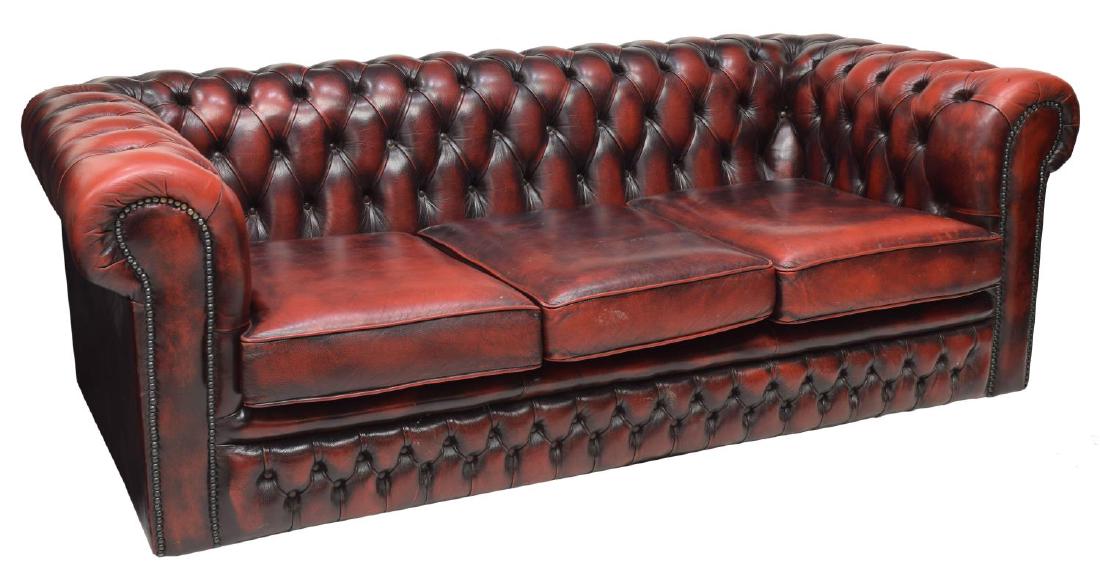 CHESTERFIELD MAROON BUTTONED LEATHER SOFA: Chesterfield maroon buttoned sofa, removable seat cushions with nail head accents, 25"h, 75"w, 33"d Start Price: $350.00