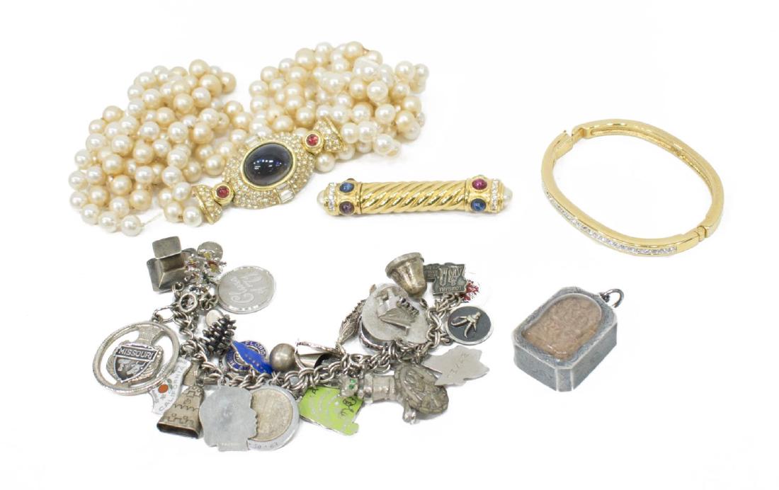 (5) DESIGN COSTUME JEWELRY GROUP, CINER, SWAROVSKI: (lot of 5) Costume jewelry group: (1) Ciner double strand faux pearl necklace, having cabochon and rhinestone set pedant, 17.5"l (from pendant to end of pearl strand); (1) gold tone brooch with colore