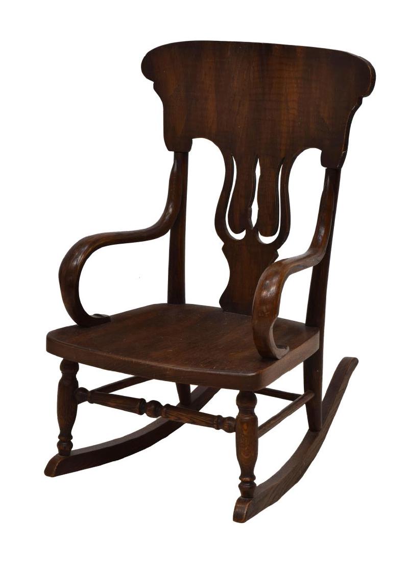 VICTORIAN STYLE CHILD'S ROCKING CHAIR: Child's Victorian style rocker, 20th c., a shaped and pierced back, bentwood arms, stretcher joined turned supports on long rockers, 26.25"h, 17"w, 22.5"d Start Price: $60.00