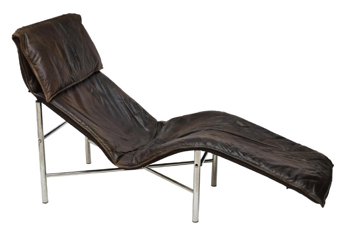 DANISH MODERN CHROME TUBULAR STEEL LOUNGE CHAIR: Danish modern lounge chair, c. 1970s, having chrome tubular steel frame, with brown leather upholstery, and padded headrest, approx 37"h, 58.25"w, 19"d Start Price: $250.00