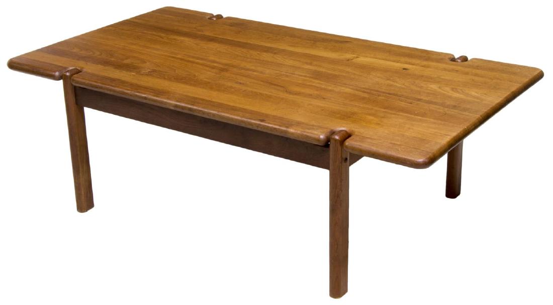 DANISH MID-CENTURY TARM STOLE TEAK COFFEE TABLE: Danish mid-century modern teakwood coffee table, c. 1950s, manufactured by Tarm Stole, having a notched tabletop, over straight legs, retains paper label on underside of tabletop, approx 17.75"h, 54.7