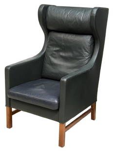 SKIPPER FURNITURE ETON LEATHER WINGBACK CHAIR: Eton wingback chair, 20th c., made by Studio Skipper Furniture, in the style of BÃ¸rge Mogensen (Denmark, 1914-1972), having green leather upholstery, with padded headrest, rising on square wood leg