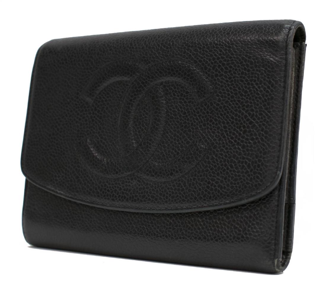 CHANEL BLACK CAVIAR LEATHER TRI-FOLD WALLET: Chanel tri-fold wallet in black Caviar leather, having gold tone hardware, interlocking stitched CC logo to exterior flap, opening to card slots and bill fold, zippered coin compartment, wear to leath