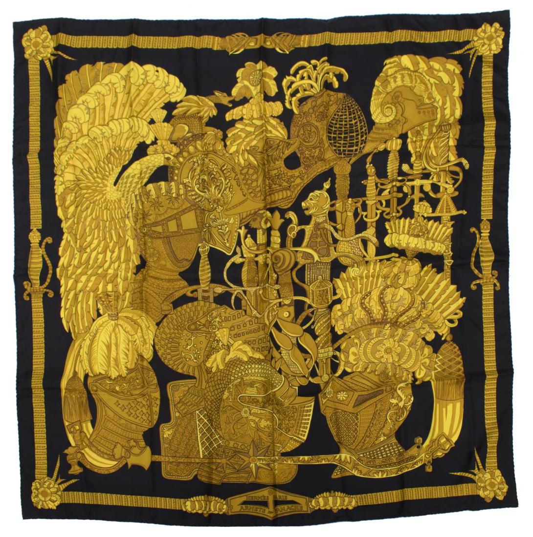 HERMES SILK SCARF, 'ARMETS EN PANACHE': Hermes silk scarf, "Armets en Panache" (Plumed Helmets), original design by Annie Faivre, in black and gold, retaining care tag, approx 35"sq *Provenance: Luxury goods are offered in partnership with 