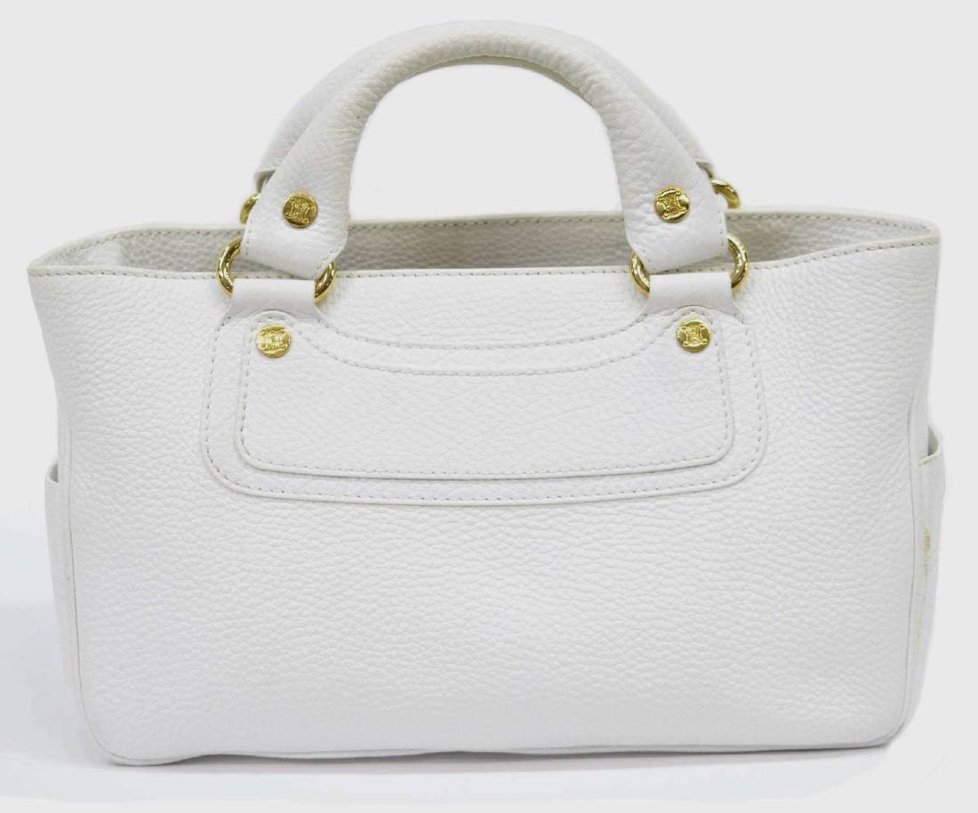 CELINE GRAINED WHITE LEATHER HANDBAG: Celine handbag in grained white leather, gold tone hardware, pockets to sides, dual top handles above top opening to divided lined interior with cell phone and slot pockets, central zippered pocket, s