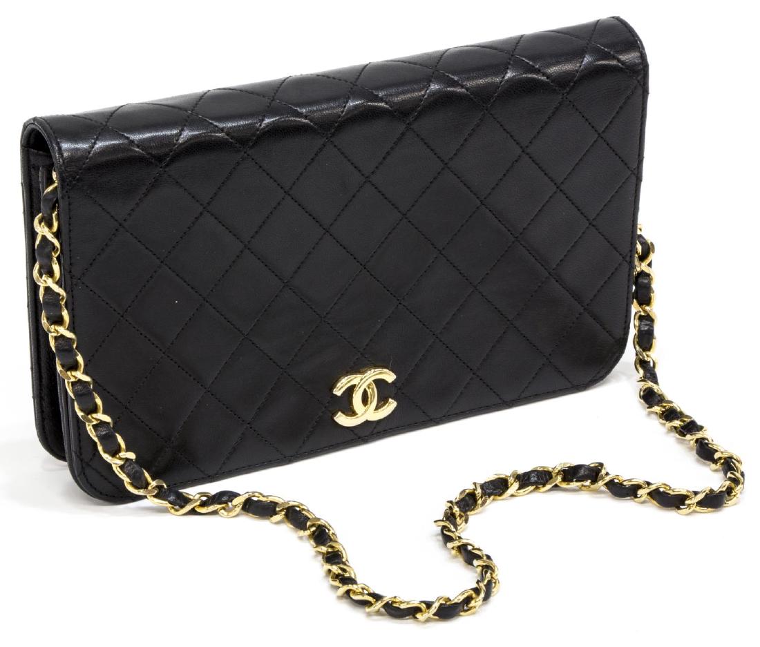 CHANEL 'MADEMOISELLE' QUILTED LEATHER SHOULDER BAG: Chanel "Mademoiselle" quilted black leather full flap shoulder bag, gold tone chain strap with intertwined leather, gold CC logo on the flap opening to red interior with single zipper pocket, presente